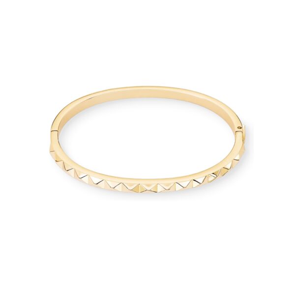 a gold bracelet with spikes on it